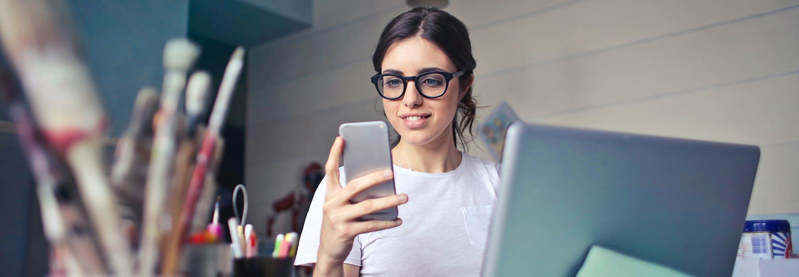 A lady using her smartphone in a studio