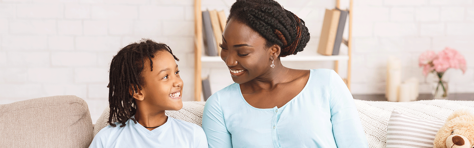 Mother and daughter laughing as they learn. 