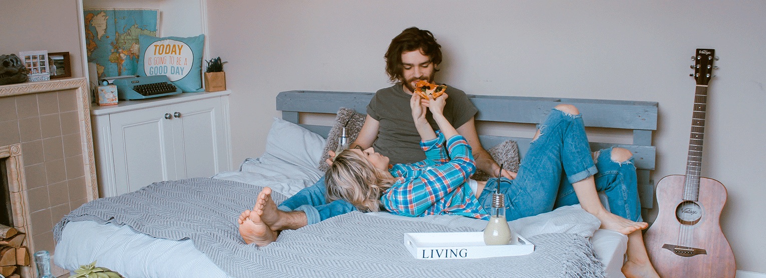 Couple having pizza on a date night. 