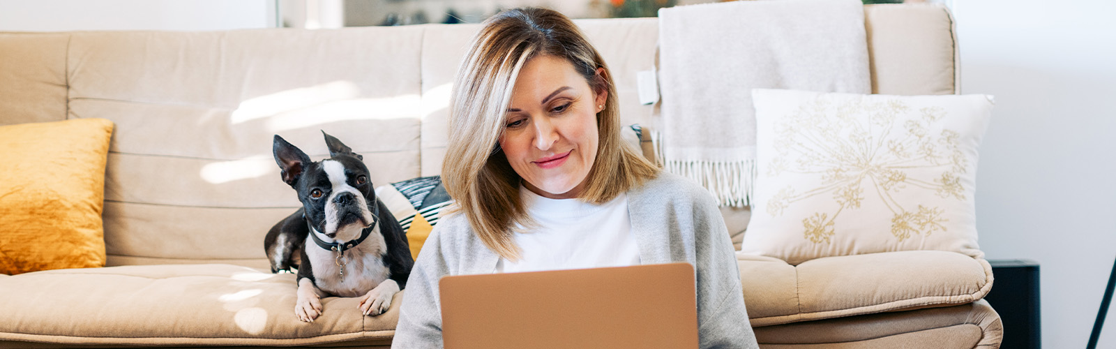 Woman and her dog checking out online applications. 