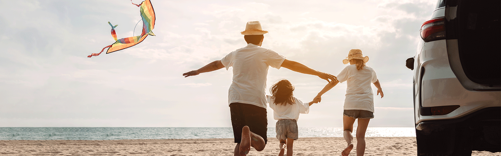 Family with a kite at the beach. 