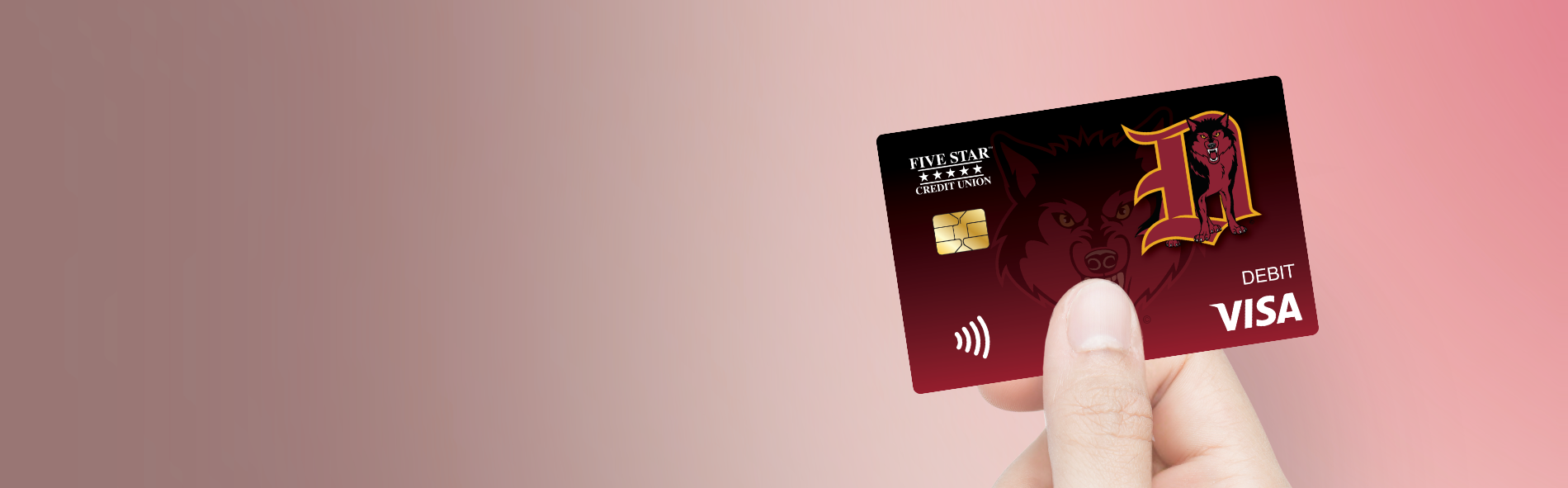 Web image of a person holding the Dothan Wolves debit card. 